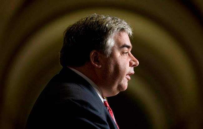 Leader of the Government in the House of Commons Peter Van Loan speaks in the foyer of the House of Commons on Parliament Hill in Ottawa, Thursday June 2, 2011. THE CANADIAN PRESS/Adrian Wyld.