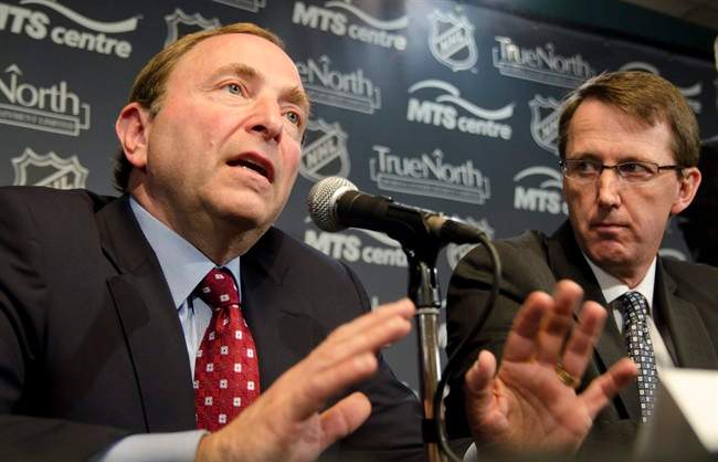 True North Sports and Entertainment Limited chairman Mark Chipman (right) looks on as NHL commissioner Gary Bettman speaks at a press conference in Winnipeg, Tuesday, May 31, 2011, announcing an NHL franchise returning to the city of Winnipeg.