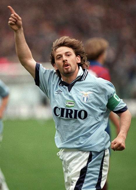 FILE - In this April 20, 1997 file photo, Lazio striker Beppe Signori celebrates after scoring a goal in Rome, Italy. Former Italy forward Giuseppe Signori is among 16 people who have reportedly been arrested for alleged involvement in a match-fixing and betting ring. The ANSA news agency reports that the others arrested include current players in Serie B and C, executives for lower-level clubs and betting operators. The police operation was based in Cremona and arrests were carried out in more than 10 cities across Italy. Signori was the Lazio captain in the mid-1990s and led Serie A in scoring in three seasons. He also made 28 appearances for Italy between 1992 and 1995, scoring seven goals. (AP Photo/Giusepe Calzuola, File).