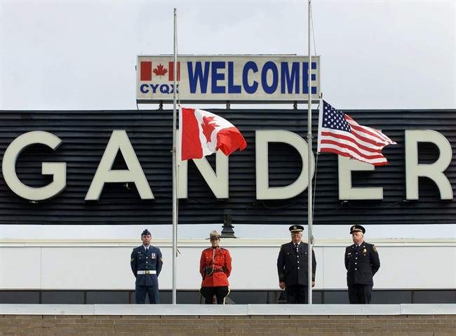 The Canadian and United States flags were lowered to half-mast at a commemorative ceremony to mark the first anniversary of the terrorist attacks against the U.S., in Gander, N.L.. on Wednesday, Sept. 11, 2002.