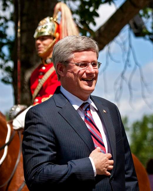 Prime Minister Stephen Harper, arrives at Spruce Meadows in Calgary, Alta., Saturday, July 9, 2011. Harper, his wife Laureen, and daughter Rachel, are taking in an equestrian event with Gov. Gen. David Johnson and his wife Sharon. THE CANADIAN PRESS/Jeff McIntosh.
