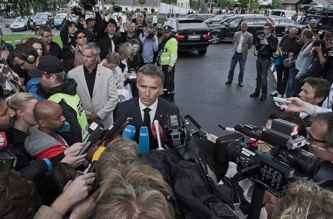 Norwegian Prime Minister Jens Stoltenberg, right, speaks to the media in Sundvollen, Norway Saturday July 23, 2011. A Norwegian gunman disguised as a police officer beckoned his victims closer before shooting them one by one, claiming at least 84 lives, in a horrific killing spree on an idyllic island teeming with youths that has left this peaceful Nordic nation in mourning. The island tragedy Friday unfolded hours after a massive explosion ripped through a high-rise building housing the prime minister's office, killing seven people. (AP Photo/ScanpixAleksander Andersen / Scanpix.