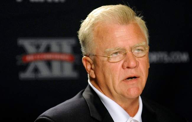 In this photo taken Monday, July 25, 2011, Texas A&M head coach Mike Sherman addresses the media during the Big 12 Conference NCAA college football media days in Dallas. Texas A&M dealt a blow to the Big 12 Conference on Wednesday, Aug. 31, 2011, saying it plans to leave by July 2012 if it is accepted by the SEC or another league. (AP Photo/Matt Strasen).