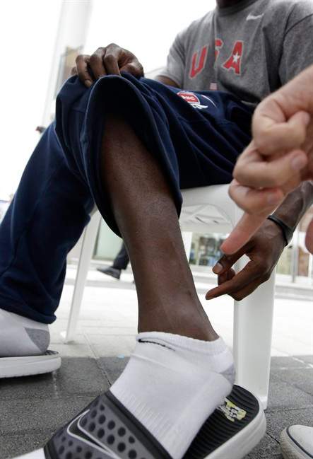 US sprinter Justin Gatlin points to a frostbite scar on his leg during an interview with the Associated Press in Daegu, South Korea, Wednesday, Aug. 24, 2011. The World Athletics Championships run Aug. 27 through Sept. 4, 2011 in Daegu. (AP Photo/David J. Phillip).