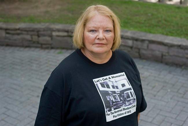 Marlie Wirtanen poses for a photograph in Montreal, Wednesday, August 31, 2011, next to the site where the Bluebird Cafe once stood. She is campaigning to have a memorial erected to commemorate the victims who perished in a fire at the Bluebird in 1972 including her sister-in-law Kathy Wirtanen. THE CANADIAN PRESS/Graham Hughes.