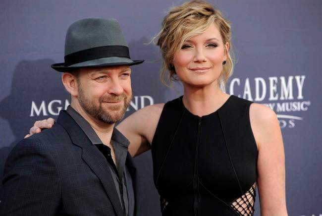 In this April 3, 2011 file photo, Kristian Bush, left, and Jennifer Nettles, of Sugarland, arrive at the 46th Annual Academy of Country Music Awards in Las Vegas.