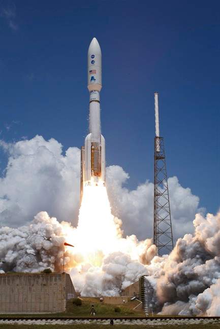 An Atlas V rocket launches with the Juno spacecraft payload from Space Launch Complex 41 in Cape Canaveral, Fla. on Friday, Aug. 5, 2011. The sun-powered robotic explorer is heading toward Jupiter on a fresh quest to discover the secret recipe for making planets. (AP Photo/NASA, Bill Ingalls).