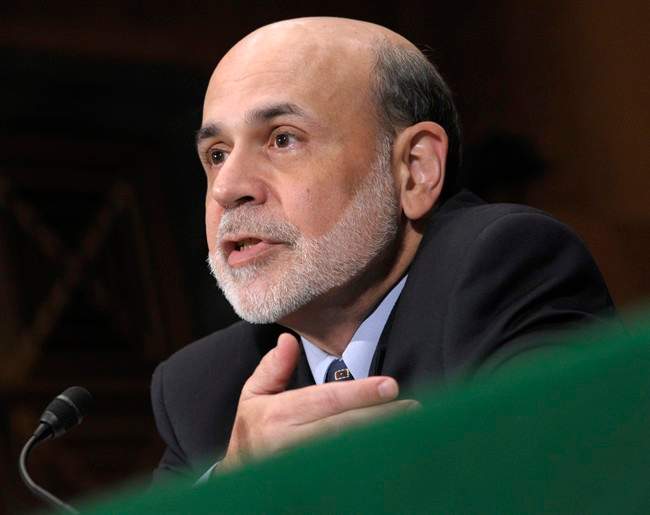 FILE - July 14, 2011 file photo, Federal Reserve Chairman Ben Bernanke testifies on Capitol Hill in Washington, before the Senate Banking Committee hearing to deliver the semiannual Monetary Policy Report. Bernanke told Congress in July that the Fed was ready to act if the economy weakened. (AP Photo/Susan Walsh, File).
