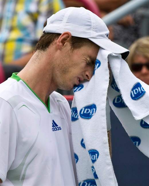 Andy Murray from Great Britain wipes his face during his match against Kevin Anderson of South Africa at the Rogers Cup tennis tournament Tuesday, August 9, 2011 in Montreal. Anderson won 6-3, 6-1. THE CANADIAN PRESS/Paul Chiasson.