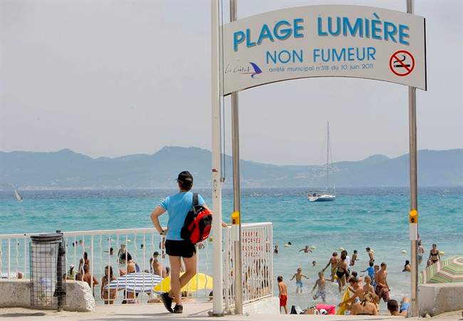 In this file photo, French tourists are seen at La Ciotat beach near Marseille, southern France. (AP Photo/Jacques Brinon).