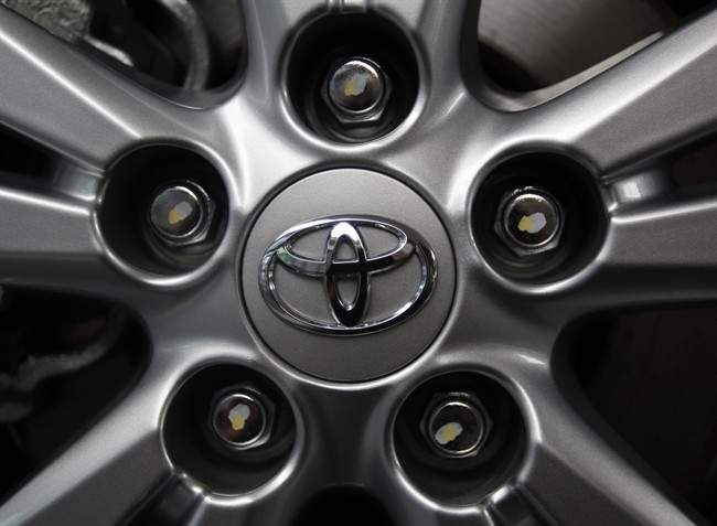 Toyota Motor Corp. recalled 340,000 gas-electric hybrid Prius cars around the world Wednesday for a defect in their parking brakes.