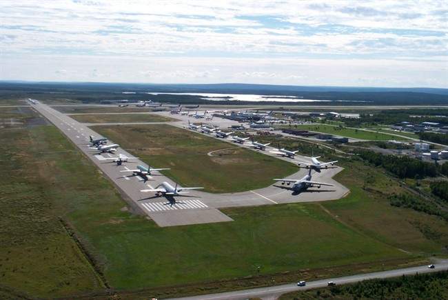 In this Sept. 12, 2001 photo provided by the Canadian government agency Nav Canada, planes line up on the runway of the Gander, airport after they were diverted to the remote town following the terrorist attacks on the United States on Sept 11, 2001. THE CANADIAN /AP,-HO-Nav Canada