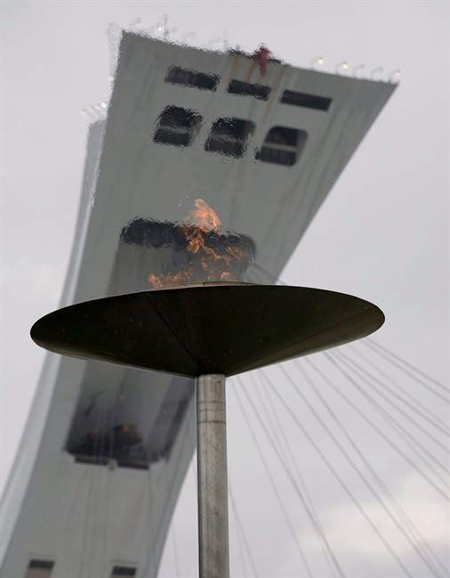 The urn in front of Montreal's Olympic Stadium in which the Olympic flame burned during the 1976 Olympics in Montreal is relit on August 8, 2008 and will remain lit for the duration of the Olympics in Beijing. Quebecers are about to kick off brainstorming sessions on the future of one of Canada's biggest white elephants: Montreal's Olympic Stadium. THE CANADIAN PRESS/Peter McCabe.