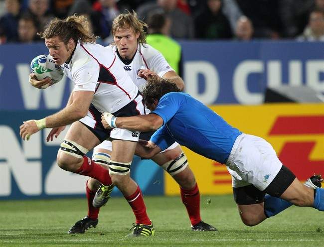 Todd Clever of the USA attempts to break through the Italian defence during their Rugby World Cup match at Trafalgar Park in Nelson, New Zealand, Tuesday, Sept. 27, 2011.(AP Photo/Rob Griffith).