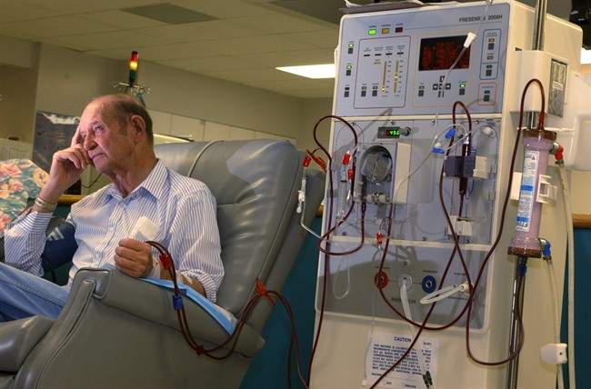FILE - In this Dec. 28, 2001 file photo, John Matheny sits during one of his three weekly sessions at the Morgantown Dialysis Center where he receives his kidney dialysis treatments, near Granville, W. Va. A major study to be published on Thursday, Sept. 22, 2011 challenges the way diabetics and others with failing kidneys have been treated for half a century, finding that three-times-a-week dialysis to cleanse the blood of toxins may not be enough. Deaths, heart attacks and hospitalizations were much higher on the day after the two-day interval between treatments each week than at other times, the federally funded study found. (AP Photo/Dale Sparks, File).