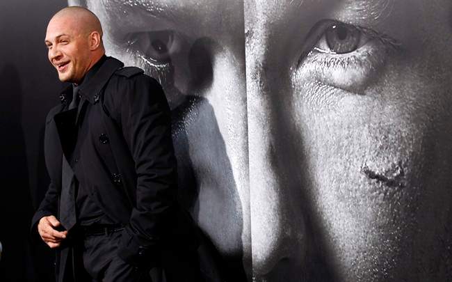 FILE - This Sept. 6, 2011 file photo shows cast member Tom Hardy arriving at the premiere of "Warrior" in Los Angeles. Mixed martial arts is hitting the nation's multiplexes Friday with "Warrior," the biggest major-studio film to date about the nascent sport. With a slew of MMA-related films on the way at the same time the UFC makes its major-network debut on Fox, "Warrior" director Gavin O'Connor believes this violent, once-banned sport has captured mainstream Hollywood's attention. (AP Photo/Matt Sayles, File).