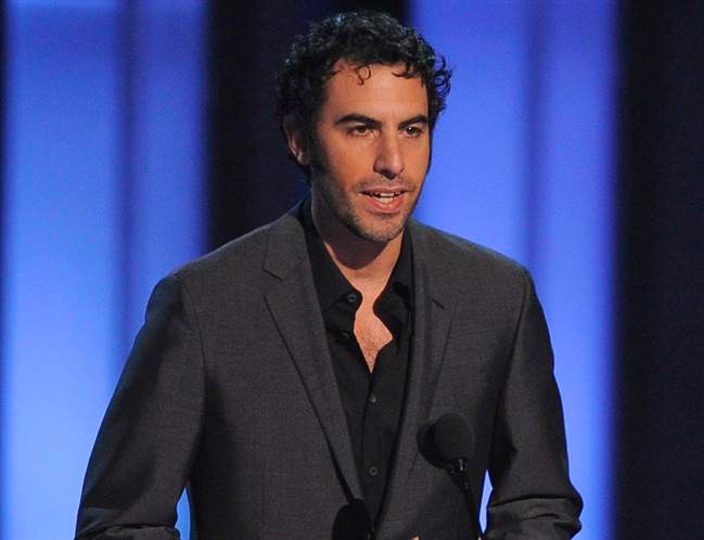 In this Jan. 6, 2010 file photo, Sacha Baron Cohen presents Johnny Depp with the award for favorite movie actor of the decade at the People’s Choice Awards in Los Angeles.