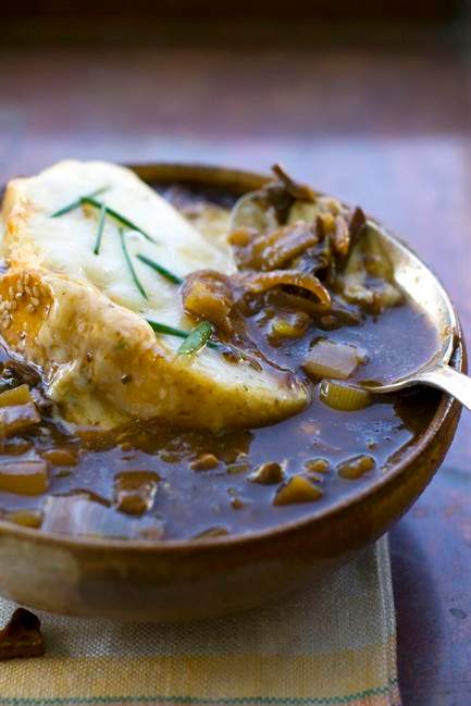 This Sept. 12, 2011 photo shows French onion and mushroom soup in Concord, N.H. French onion soup is a classic well suited for fall. The dark, rich broth and cheese-encrusted top are perfect for fending off a chilly evening. (AP Photo/Matthew Mead).