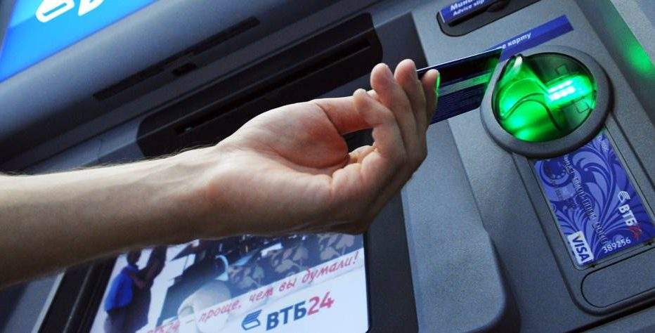 Hamilton police are investigating two robberies near downtown ATMs.