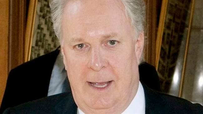 Quebec Premier Jean Charest walks on June 7, 2011 at the legislature in Quebec City. THE CANADIAN PRESS/Jacques Boissinot.