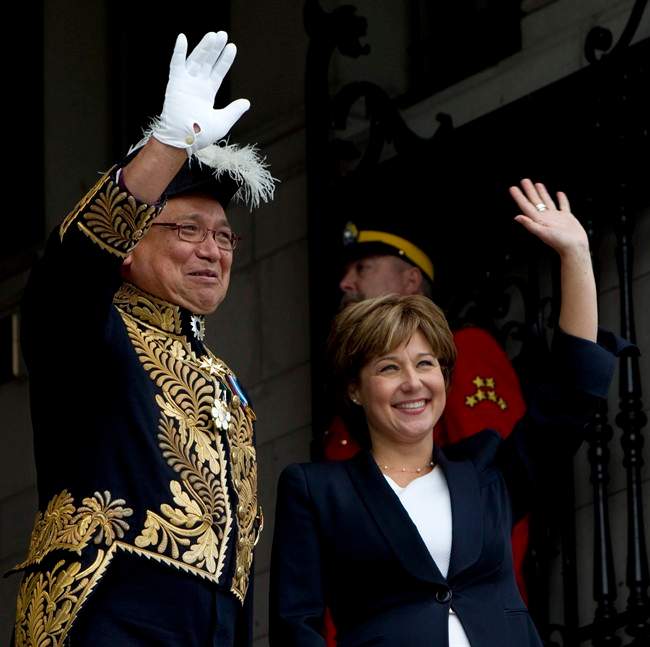 Lieutenant Governor Steven Point and B.C. Premier Christy Clark wave to onlookers prior to Point delivering the Speech from the Throne at the Legislature in Victoria, B.C. Monday, Oct. 3, 2011. THE CANADIAN PRESS/Jonathan Hayward.
