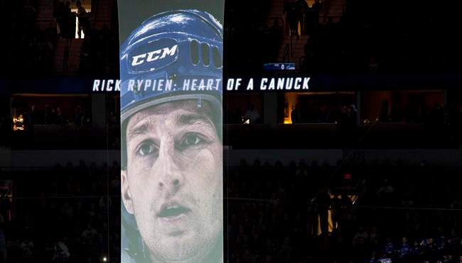 A giant banner with the picture of former Vancouver Canuck Rick Rypien is seen during a ceremony prior to a game against the New York Rangers at Rogers Arena in Vancouver, B.C. Tuesday, Oct.18, 2011. Rypien died earlier this year. THE CANADIAN PRESS/Jonathan Hayward.