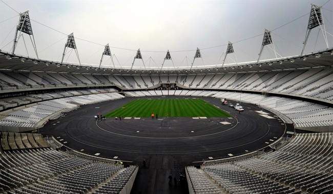 FILE - In this March 29, 2011 file photo, a view of the London 2012 Olympic stadium, in London. The IOC wants London organizers to make sure the opening ceremony of next year's Olympics finishes by midnight so athletes can return to the village at a reasonable hour. (AP Photo/Tom Hevezi, File).