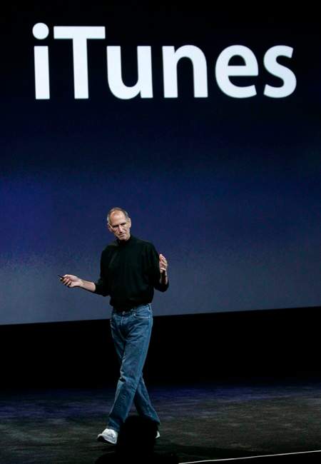 FILE - In this Sept. 9, 2008 file photo, Apple CEO Steve Jobs talks about iTunes 8 at an event in San Francisco. Jobs' entree into the music world was more than a success _ it was a phenomenon. Today, iTunes owns the majority of the digital sales market, has redefined listening experience, and has for all purposes become the way that music is consumed. (AP Photo/Paul Sakuma, file).
