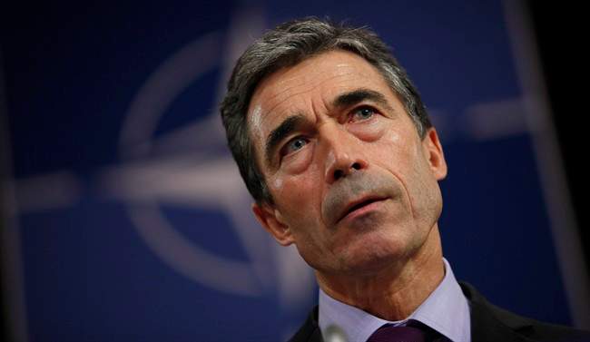 NATO Secretary General Anders Fogh Rasmussen listens to questions during a media conference at NATO headquarters in Brussels on Monday, Oct. 3, 2011.  (File photo).