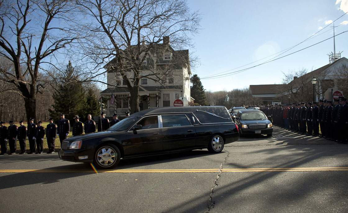 The hearse carrying the casket of Daniel Barden, 7, a victim of the shooting at Sandy Hook Elementary School, leaves St. Rose of Lima Church December 19, 2012 in Newtown, Connecticut. 