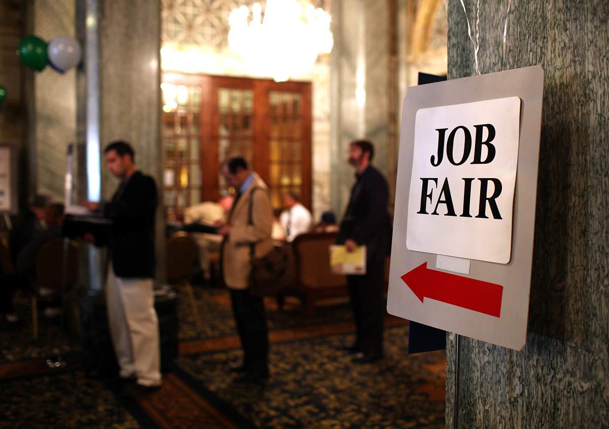 Job seekers wait in line to enter the San Francisco Hire Event job fair on November 9, 2011 in San Francisco, California.