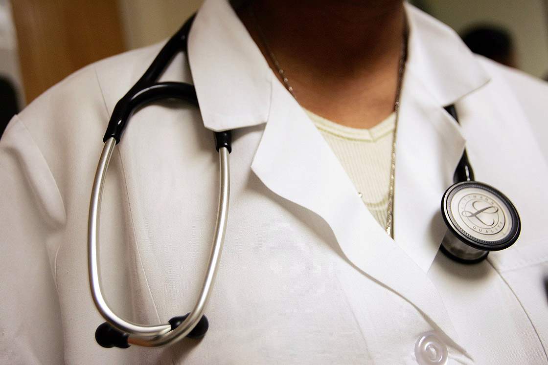 FILE: A physician wears a stethoscope.