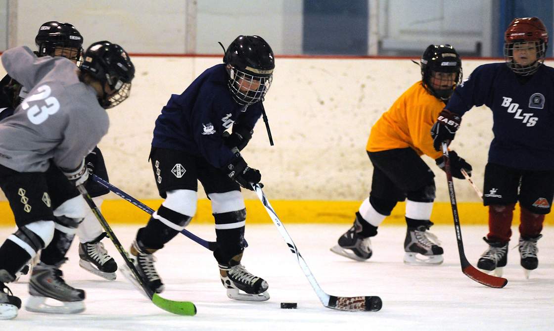 Hockey Winnipeg has barred the parents of a player from rinks for three seasons following a locker room fist fight.