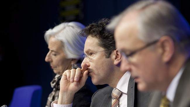 From left, Managing Director of the International Monetary Fund Christine Lagarde, Dutch Finance Minister and chief of the eurogroup Jeroen Dijsselbloem and EU Commissioner for Monetary Affairs Olli Rehn participate in a media conference after an emergency eurogroup meeting in Brussels on Monday, March 25, 2013. 