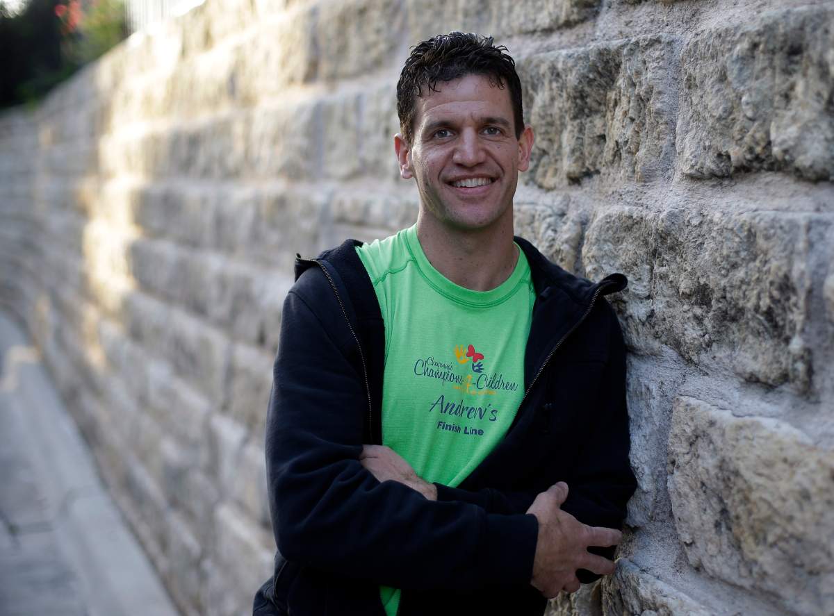 Marathon runner Joe Berti poses for a photo in Austin, Texas, Thursday, April 18, 2013. Berti had just finished the Boston Marathon seconds before two bombs exploded at the finish line. Two days later, he was in his home state of Texas when he saw a fertilizer plant explode near Waco.