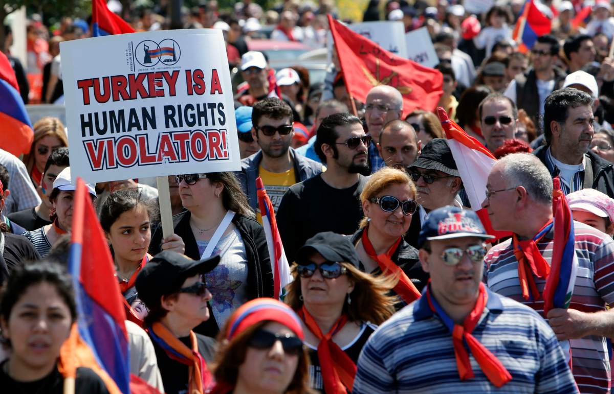 Armenians take part in a march north of the Lebanese capital Beirut, to commemorate the 98th anniversary of the Ottoman Turkish genocide against the Armenian people on April 24, 2013.
