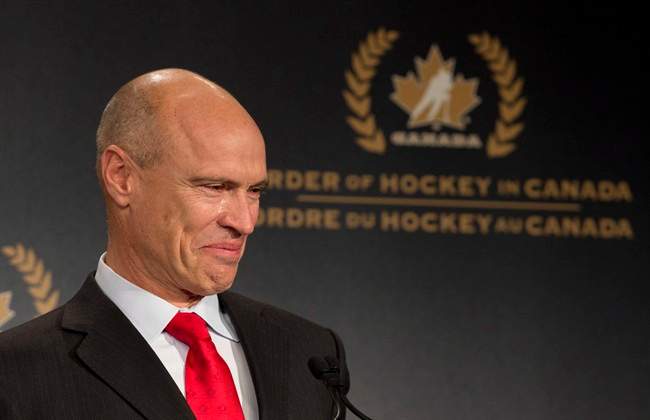 Tears roll down the cheek of former NHL great Mark Messier as he speaks during his induction into the Order of Hockey in Canada in Ottawa, Monday April 8, 2013.