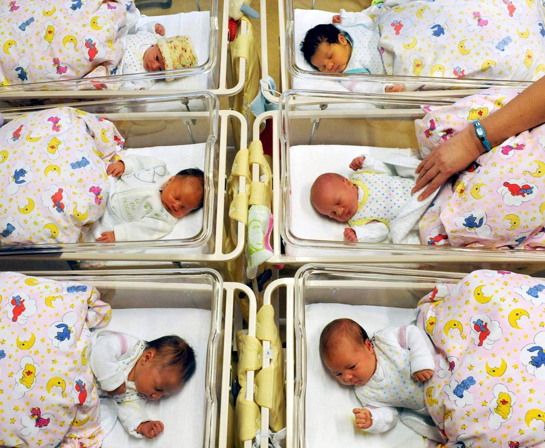 Newborn babies lay in their beds at the St. Elisabeth and St. Barbara hospital in Halle, eastern Germany, on January 2, 2012.