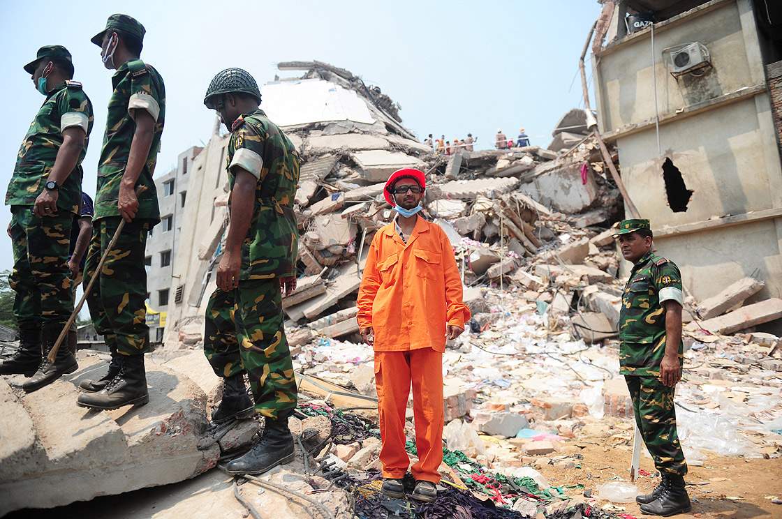 Bangladeshi army personal seal off an area after relatives of the missing and dead burst into angry protests at the disaster site of an eight-storey building that collapsed 48 hours earlier in Savar, on the outskirts of Dhaka, on April 26, 2013. (Getty Images)