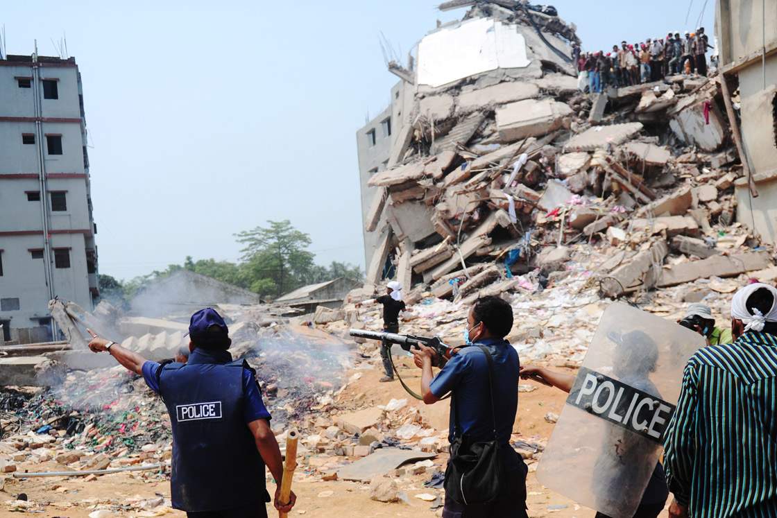 Bangladeshi police fire tear gas after relatives of the missing and dead burst into angry protests at the disaster site on the outskirts of Dhaka, on April 26, 2013.  (Getty Images)