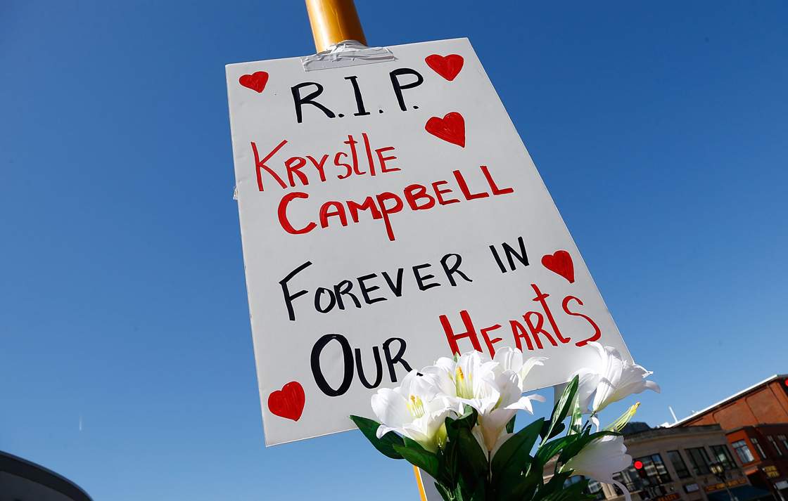 Flowers and a sign are left on a street post in Medford Square in remembrance of Krystle Campbell, 29, of Medford, Massachusetts, who was killed by the bomb explosions at the Boston Marathon on April 17, 2013 in Medford, Massachusetts. 