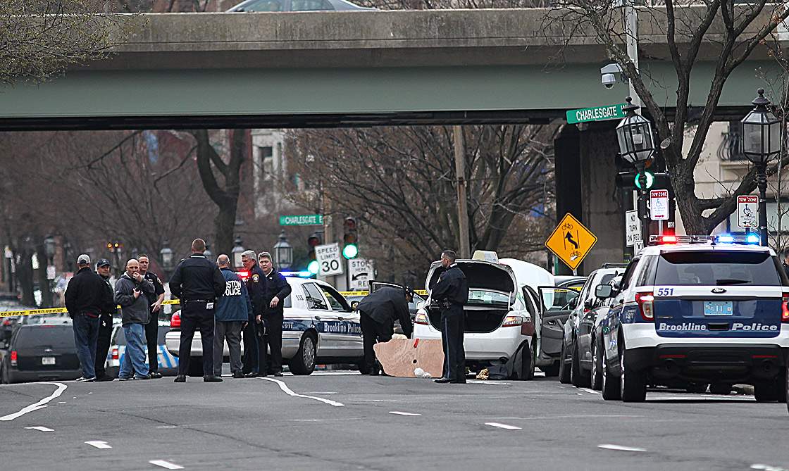 A section of Kenmore Square is shut down as activity was centered around a taxi as the city is shut down as a manhunt is underway for a suspect in the terrorist bombing of the 117th Boston Marathon earlier this week.