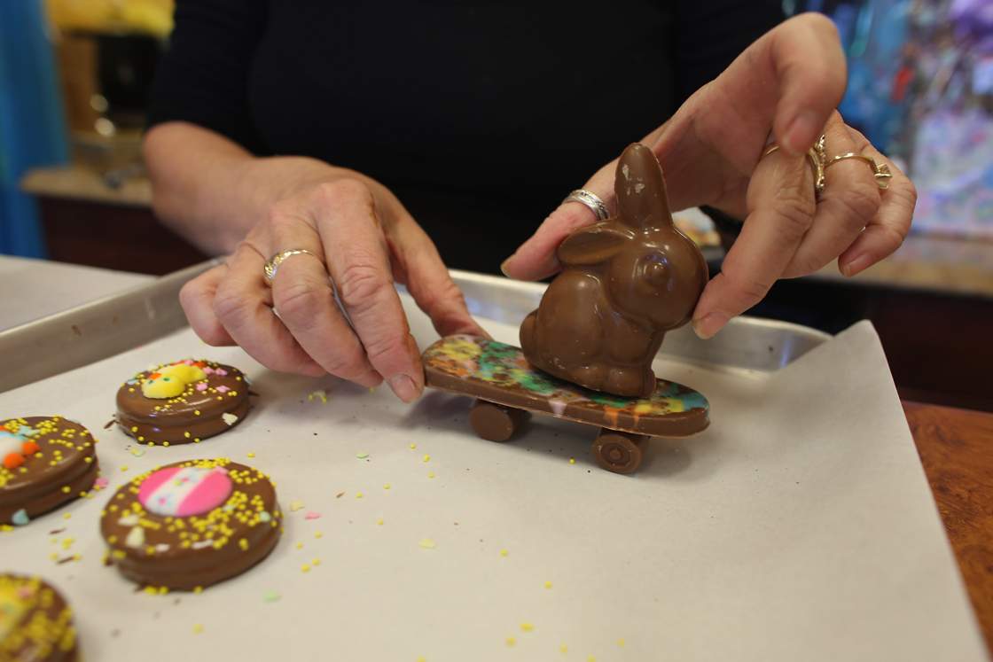 Darlene Eddy handles a skateboarding chocolate Easter bunny in her store Amazing Chocolates on March 28, 2013 in Hollywood, Florida.