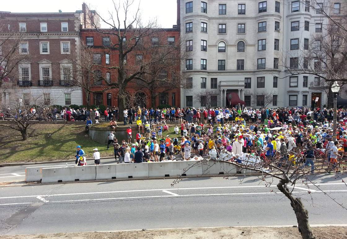 Displaced runners who didn't finish the race were grouped together away from the marathon areas cordoned off by police.