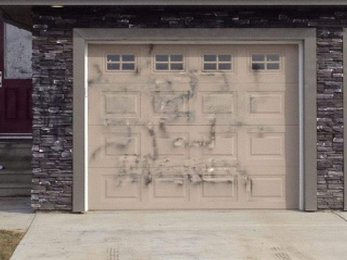 Police are investigating after disturbing graffiti was found on this souteast Edmonton home. 