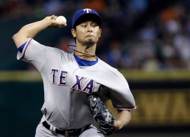 Texas Rangers' Yu Darvish delivers against the Houston Astros in the first inning of a baseball game Tuesday, April 2, 2013, in Houston.