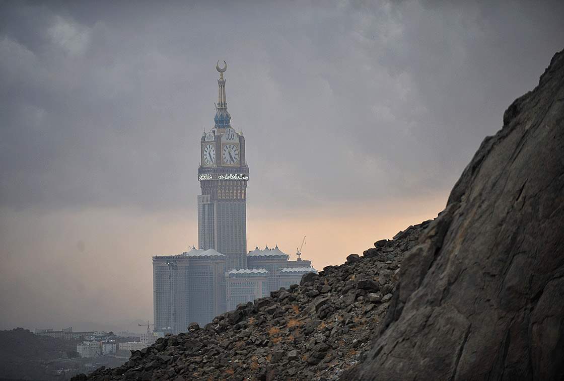 The Abraj Al-Bait Towers also known as the Mecca Royal Hotel Clock Tower, is seen from Jabal al-Noor or ‘Mountain of Light’ overlooking the holy city of Mecca on October 21, 2012