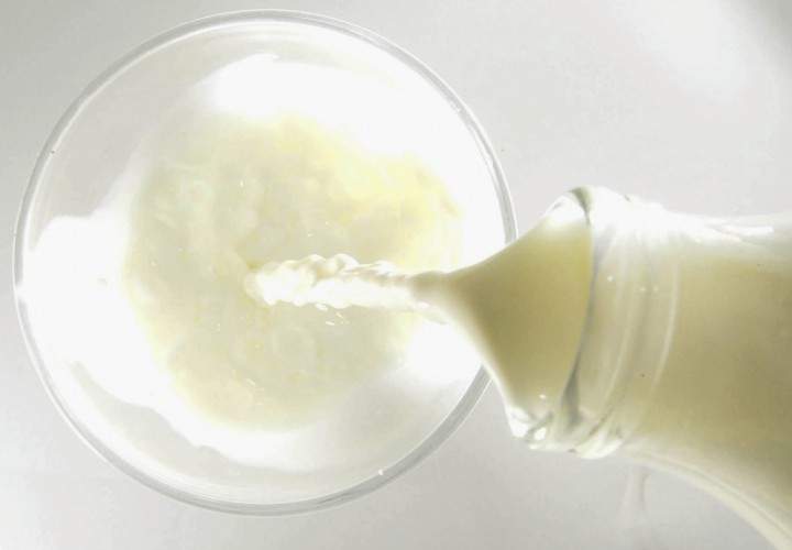 This illustration shows milk being poured in to a glass on December 10, 2003 in London.
