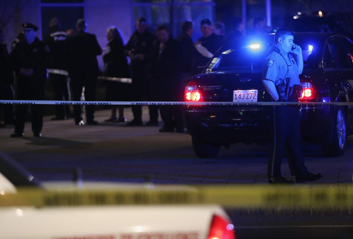 Police investigate the scene where a Massachusetts Institute of Technology campus police officer was shot and killed at the camous on April 18, 2013 in Cambridge, Massachusetts. 
