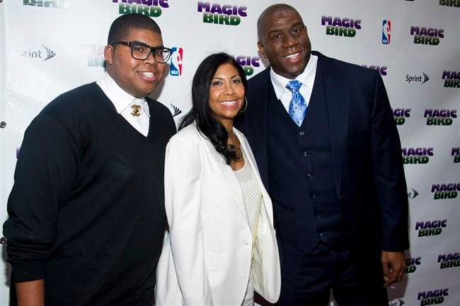 This April 11, 2012 file photo shows Magic Johnson, right, his wife Cookie and son E.J. arriving for the opening night performance of the Broadway play \”Magic/Bird\” in New York.